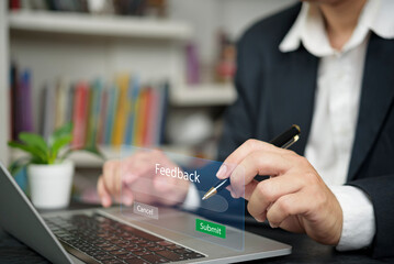 Businessman hand use laptop submit online feedback. Virtual interface, customer service survey. Business technology, user experience, satisfaction review. Submit button, corporate office.