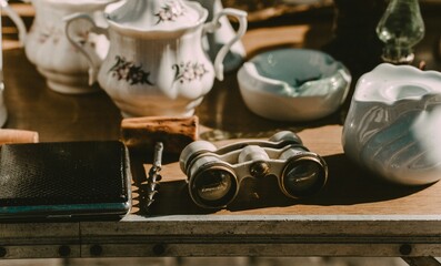 A traditional Chinese tea set arranged neatly on a wooden table with soft lighting.
