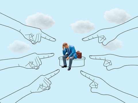 A distressed miniature businessman sits on a pedestal, surrounded by accusatory hands pointing at him from all directions. This image tells a story of social pressure