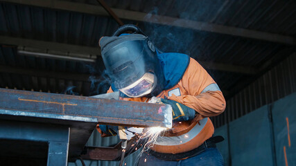 Welder operator in the process of constructing metal structures using TIG MIG MAG welding techniques