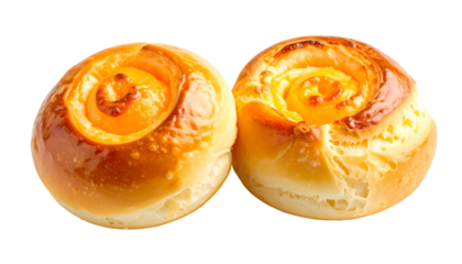 Two golden-brown, baked swirl buns with a bright yellow, creamy filling