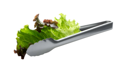 Lettuce gripped by metallic tongs against a black backdrop