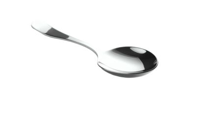 Shiny spoon lying at an angle on a dark surface