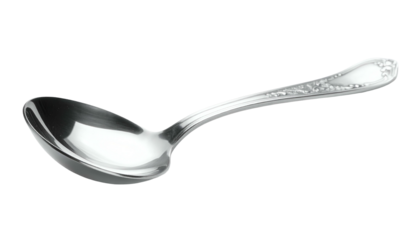 Gleaming silver spoon with floral details on black background