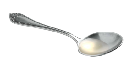 Silver spoon with a small amount of liquid on a black backdrop