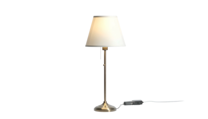 Lit lamp with tan shade on simple metal stand, black background