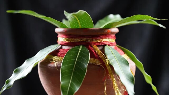 Traditional Hindu Kalash Pot with Mango Leaves for Puja Ceremony.