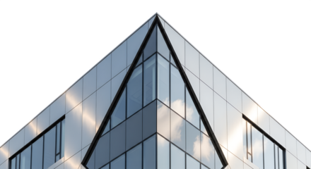 Modern building with triangular glass facade and reflections in sunlight  