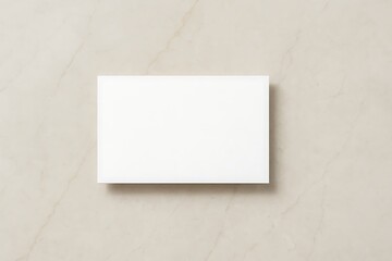 Top-down business card mockup on neutral marble surface, soft daylight reflections and balanced shadows, perfect for branding and identity design.
