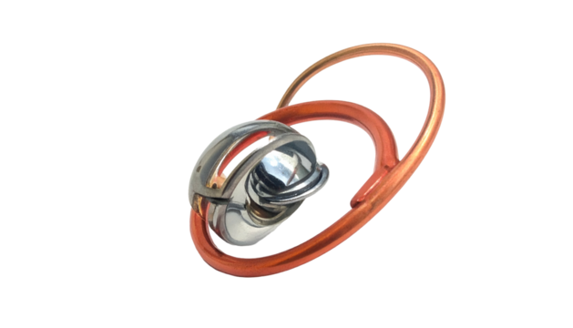 Abstract metal puzzle with intertwined copper and silver elements