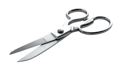 Shiny silver scissors slightly open on a dark background