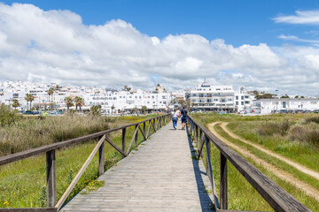 Conil, Spain - April 17, 2025: Streets of the historic center of the city of Conil, province of Cadiz, during the Easter festivities in Conil, Spain. © josevgluis