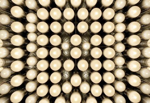 Symmetrical Pattern of Circular White Light Bulbs in Rows Viewed from Below