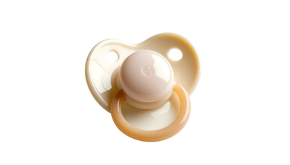 Beige pacifier, heart shaped, on black backdrop, soft lighting