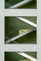 Geometric Stairwell Viewed Through Rectangular Wall Openings