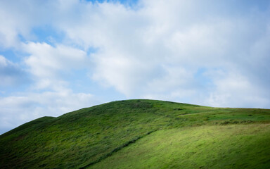 green hill and blue sky