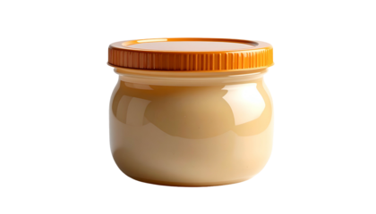 Glass jar filled with beige creamy substance, brown ribbed lid