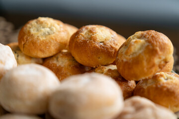 Detail of mini pies behind mini donuts.
