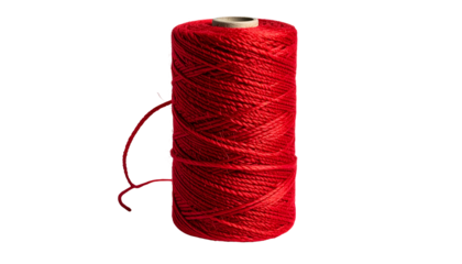 A cylindrical spool of red thread against a stark black background, thread unwinding