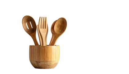 Wooden utensils sit neatly in a matching rounded bowl