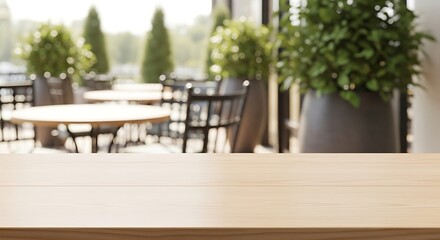 Obraz premium Empty wooden table top with a blurred background of an outdoor cafe patio.