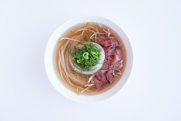 Authentic Vietnamese Pho Noodle Soup with Beef and Fresh Herbs