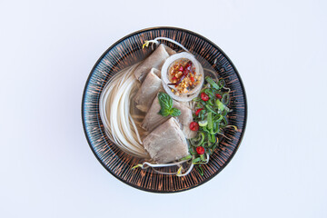 Authentic Vietnamese Pho Noodle Soup with Beef and Fresh Herbs