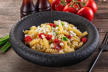 Italian pasta fusili with curd