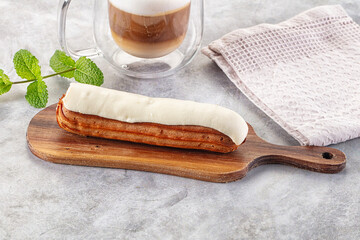 White vanilla eclair with icing