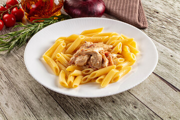 Pasta penne with chicken in cream sauce