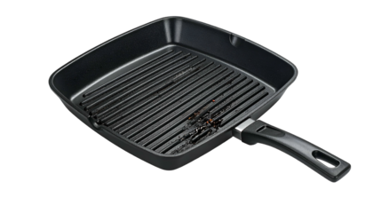 Grill pan, square, with ridges and some food remnants on black background