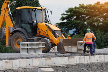 Heavy machinery and skilled laborers work in unison on a construction site, laying the groundwork for a new infrastructure project with precast concrete.