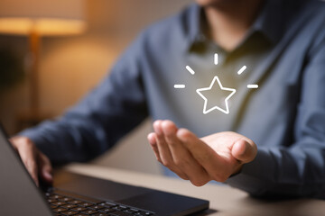 redeem, points, loyalty, rewards, voucher, coupon, Person using laptop and holding digital star...