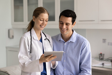 Fototapeta premium Patient smiling while therapist sharing good health news