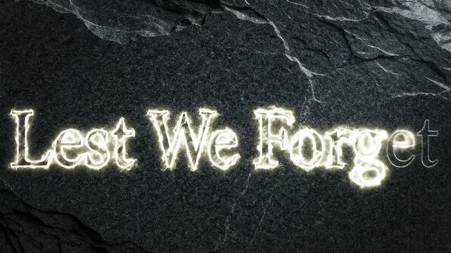 A Solemn Cinematic Title Card Revealing "Lest We Forget" Carved into Ancient Granite for Remembrance and Sacrifice