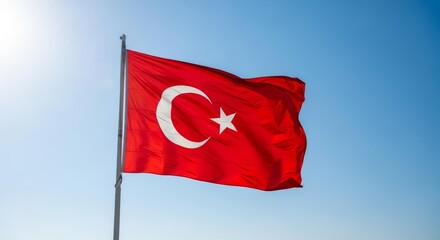 Bright Red Flag of Turkey with White Crescent and Star Waving in Blue Sky