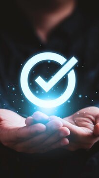 Hands holding a glowing checkmark symbolizing success and approval