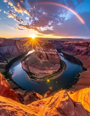 Vivid sunset over a scenic canyon river bend and a majestic rainbow