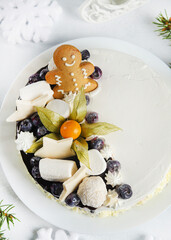 Christmas Cake with Gingerbread Man and Berries