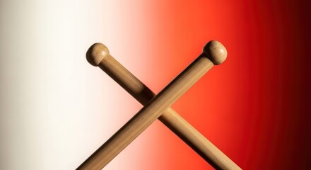 Dramatic crossed drumsticks against gradient red background showcasing musical rhythm