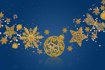 Christmas blue background with Christmas tree decorations with a golden snowflake, star and ball and golden lights with copy space. New Year and Christmas card.
