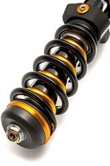 Close-up of a motorcycle suspension shock absorber.  Black and gold components.  Visible coil spring