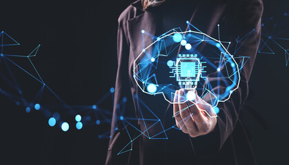 Futuristic concept of artificial intelligence chip in holographic brain interface held by businesswoman on dark background with digital network lines.