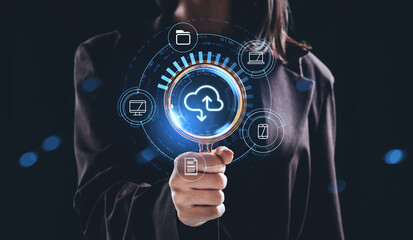 Woman holding magnifying glass with glowing holographic cloud storage interface surrounded by device icons representing data sharing concept in networked system.