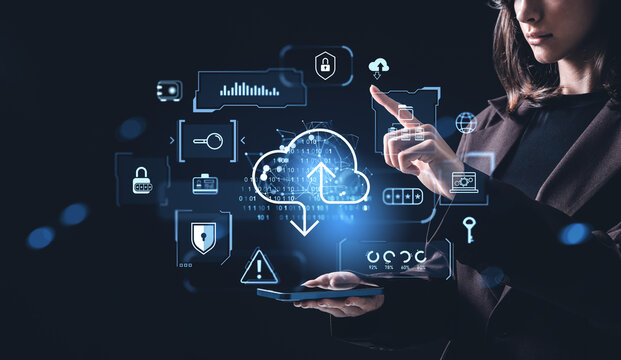 Woman interacting with holographic cloud storage interface for secure online data management on dark background conceptually illustrating internet network systems.