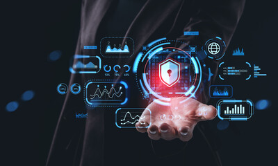 Cybersecurity protection concept with digital hologram lock and data graphs floating above a businessman's open hand in a futuristic interface..