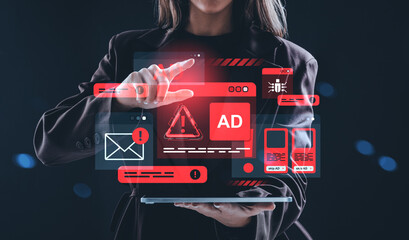Woman interacting with digital hologram of online threats and adware alerts using futuristic tablet interface in cybersecurity concept scene.
