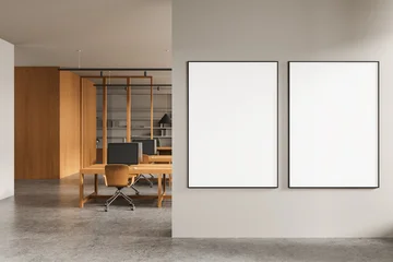 Fototapete Wohnzimmer Modern office interior with blank white posters on partition wall and wooden desks in background illuminated by ceiling lights. 3D Rendering  © ImageFlow