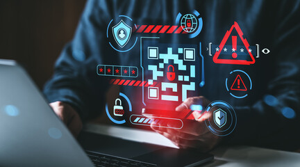 Naklejka na ściany i meble Cybersecurity alert with fake QR code and virus warning displayed on transparent digital interface over person using phone and laptop in dark background. Naklejka na ściany i meble Cybersecurity alert with fake QR code and virus warning displayed on transparent digital interface over person using phone and laptop in dark background.