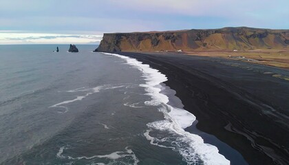 Aerial View of Volcanic Black Sand Beach and Dramatic Coastline
